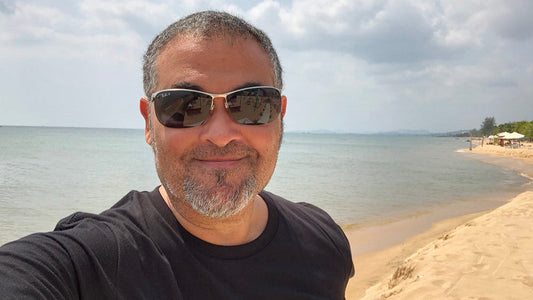author ty hutchinson standing on a remote beach thinking about his next binge worthy popcorn thriller
