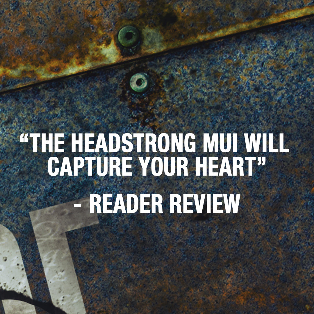 A textured graphic with a quote reading “THE HEADSTRONG MUI WILL CAPTURE YOUR HEART - READER REVIEW” in bold white text over a close-up rusty blue metal surface.